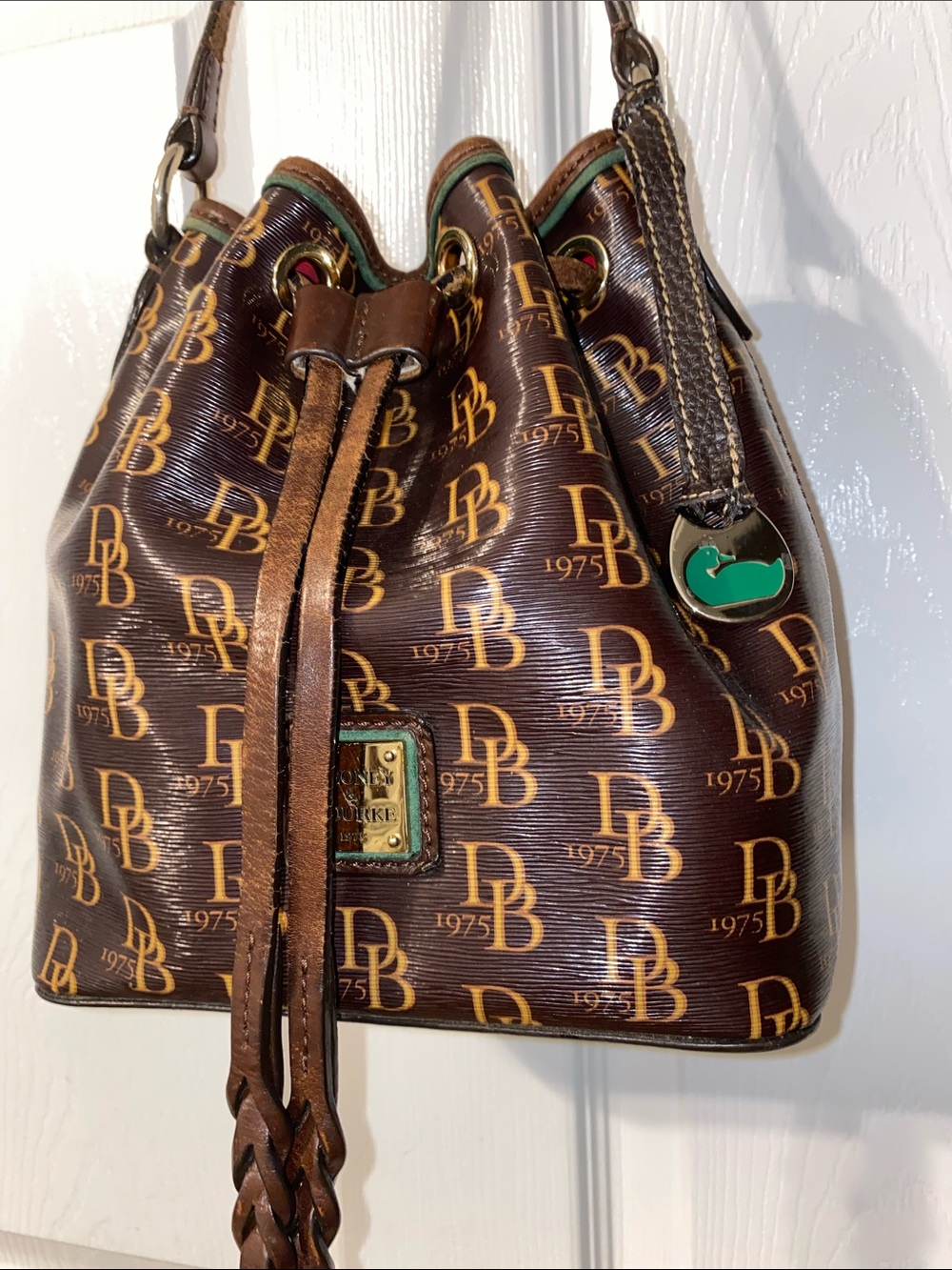 Dooney & Bourke Brown DB Monogram Braided Drawstring Bucket Bag - Picture 4 of 12